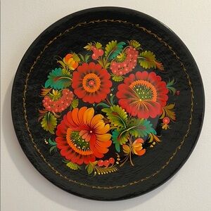 Folk art. Wooden painted plate for wall decoration